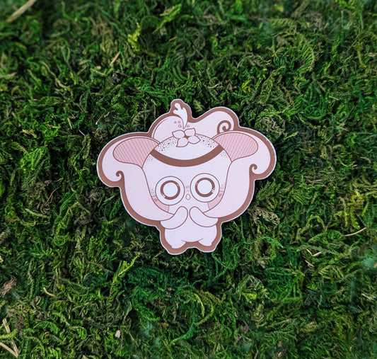 Photograph of a mossy background with a vinyl sticker of an earthstar puffball Mushkin.