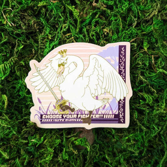Photograph of a mossy background with a vinyl sticker of a Mute Swan with a crown and a rapier. Under the goose it says, “Choose your Fighter!!! Mute Swan”