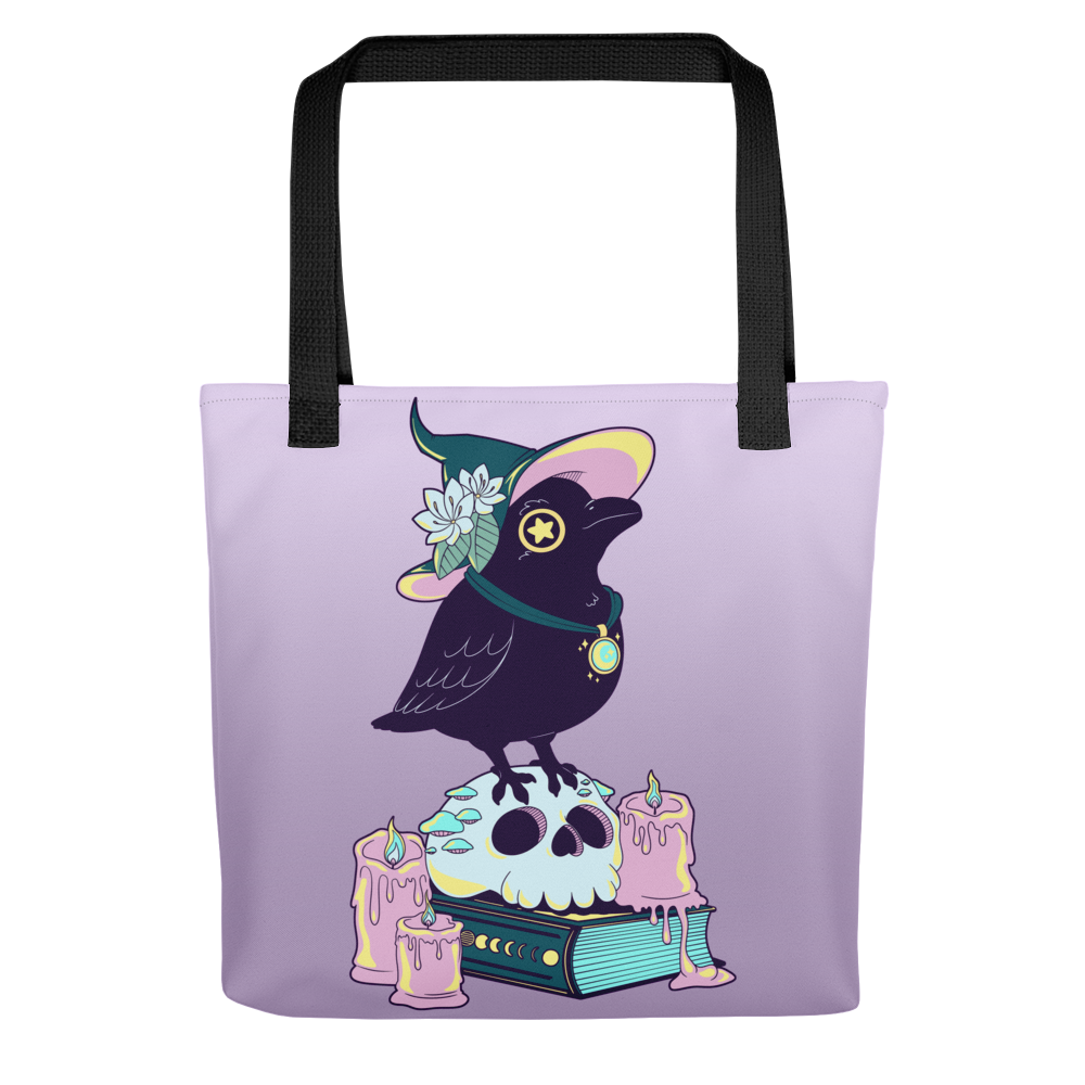 An advertising graphic of a tote bag that is blue and orange gradient. There is a raven on the bag with an orange witch hat. They're carrying a wood staff with a lantern on it.
