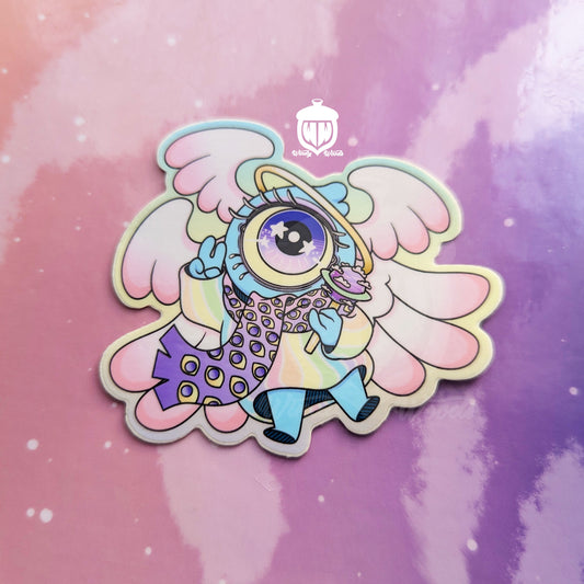 A photograph of a vinyl sticker against a pink and purple background. The sticker features Chamuel, the adorable biblically accurate angel. The sticker is approx 2.5 by 3 inches and is made of super durable waterproof vinyl.